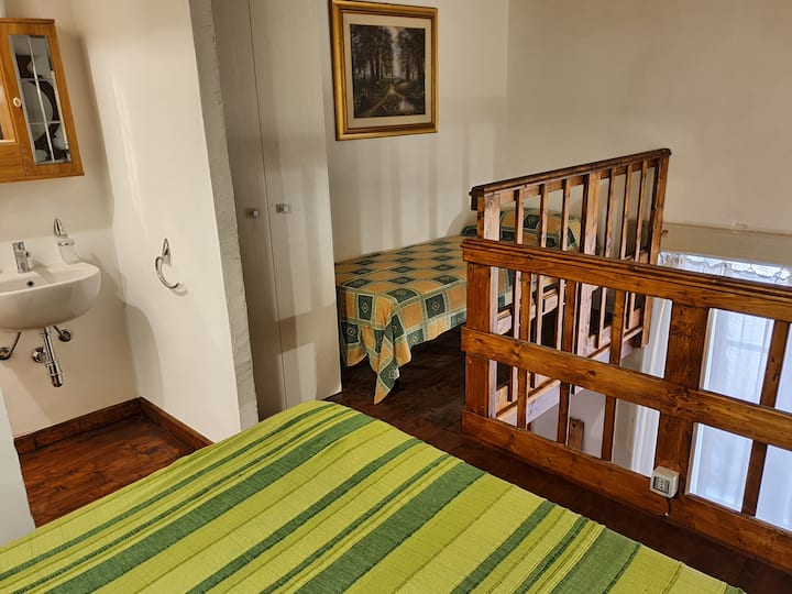 sleeping loft, toilet,  wardorbe  and single bed