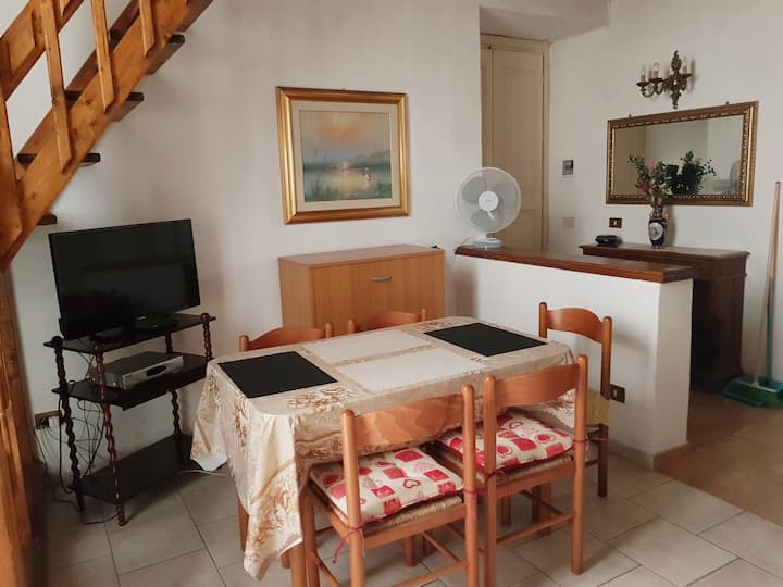 Downstairs: table with chairs, tv.